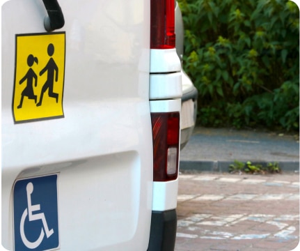 back of van with children crossing sticker